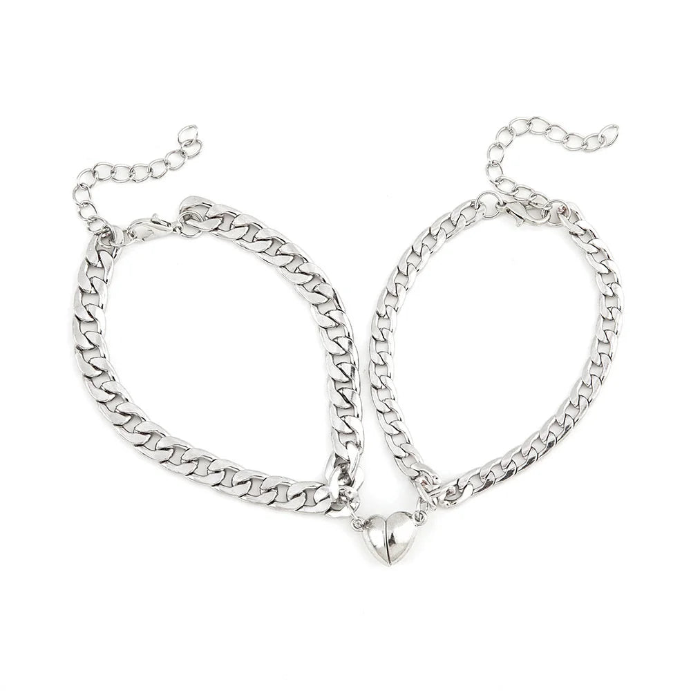 Pulsera de acero inoxidable para parejas, sencilla y moderna, con imán en forma de corazón, atractiva joya para la mano para hombres y mujeres.