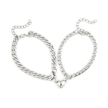 Pulsera de acero inoxidable para parejas, sencilla y moderna, con imán en forma de corazón, atractiva joya para la mano para hombres y mujeres.